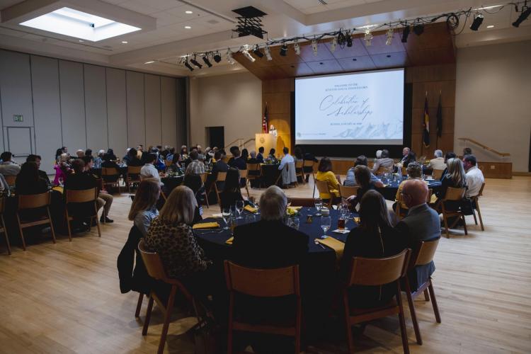 Guests at the annual Chancellor’s Celebration of Scholarships Luncheon listen to welcome remarks by Mary Kraus, vice provost and associate vice chancellor for undergraduate education. (Photo by Matt Tyrie/University of Colorado)