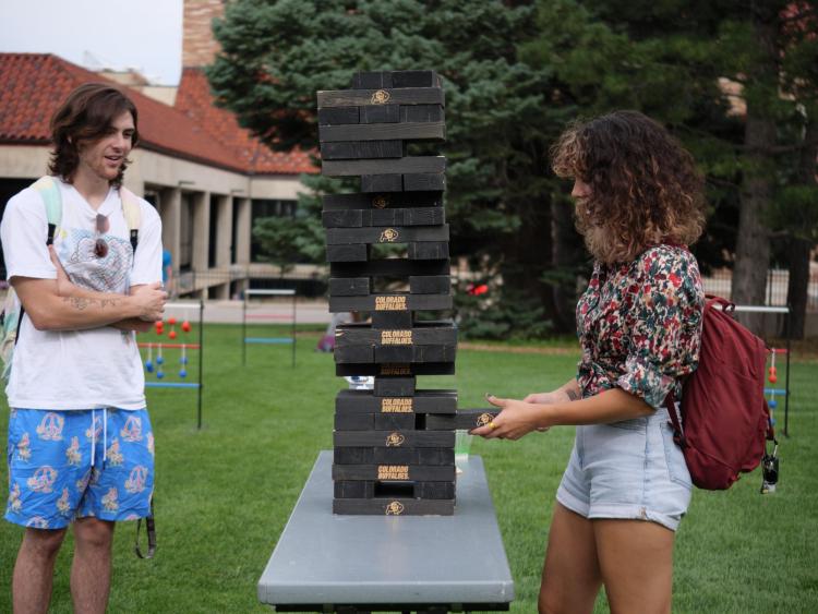 Students playing lawn Jenga at a CU event