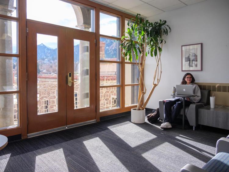 Student studying on the fifth floor of the UMC