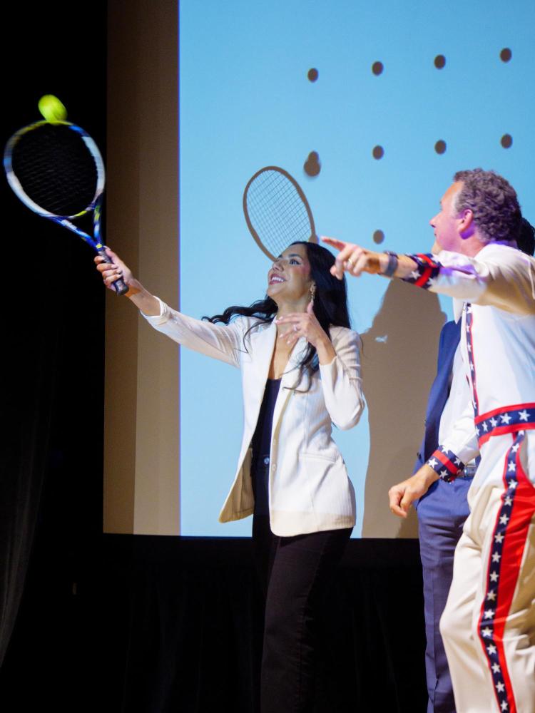 Hitting tennis ball into crowd