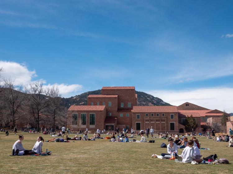students enjoying a spring day on Norlin Quad