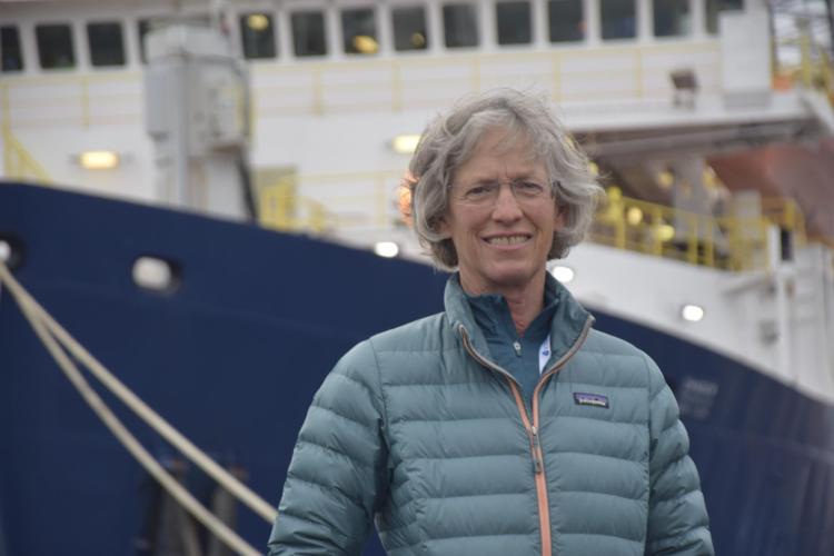 Anne Jennings standing in front of the JR ship