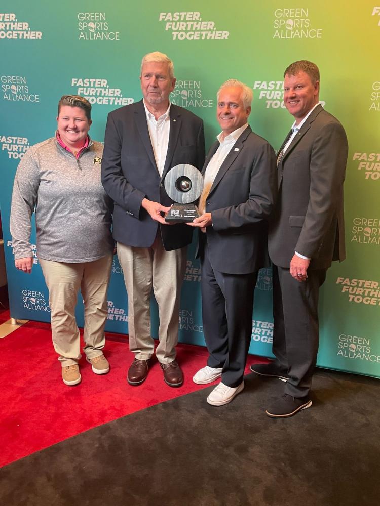 Angie Gilbert, Dave Newport, Jamie Zaninovich and Jason Depaepe receiving an award