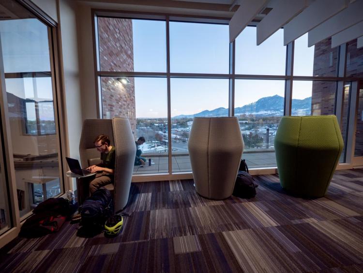 person studying in study pod on campus