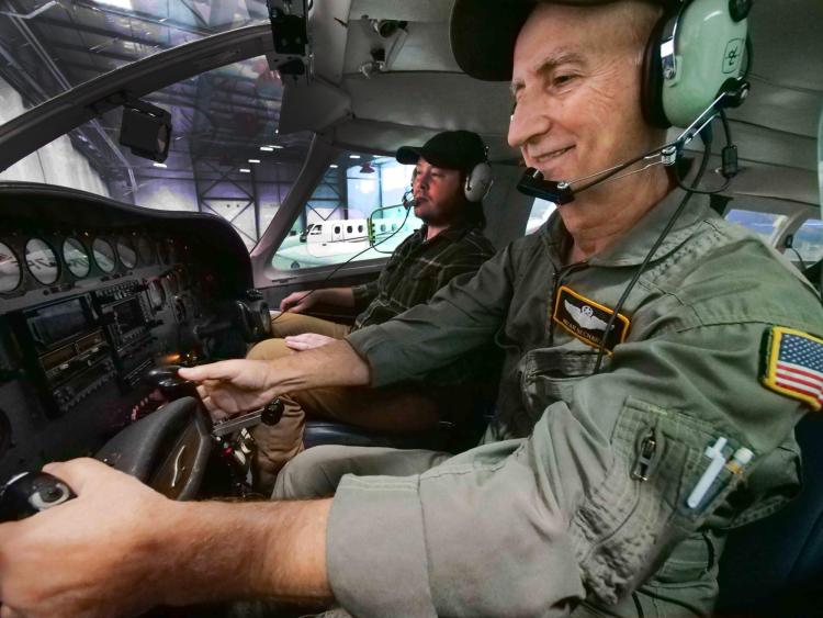 Pilot Nizar Bechara and graduate student Phillip Stratton in a cockpit