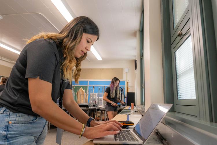 Hernandez's students set up air monitors in classroom