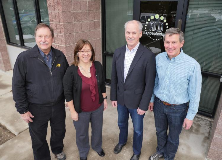 Professor Alan Weimer, CU Boulder alum Karen Buechler, CU Boulder alum Mike Masterson and Professor Steve George at ALD NanoSolutions in Broomfield, Colorado.