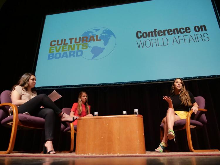 Aly Raisman on stage at Conference on World Affairs