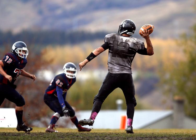 teens playing football