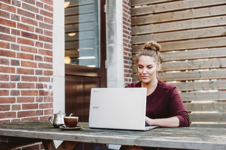 person working on laptop outside