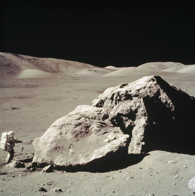 Apollo 17 astronaut Harrison Schmitt near a boulder in the moon's Taurus-Littrow Valley.