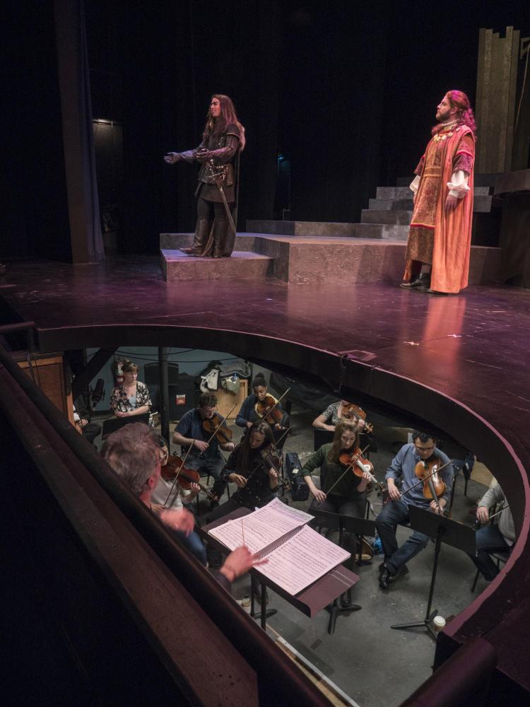 View of the stage and orchestra pit as College of Music students perform in the dress rehearsal for Ariodante. Photo by Glenn Asakawa.