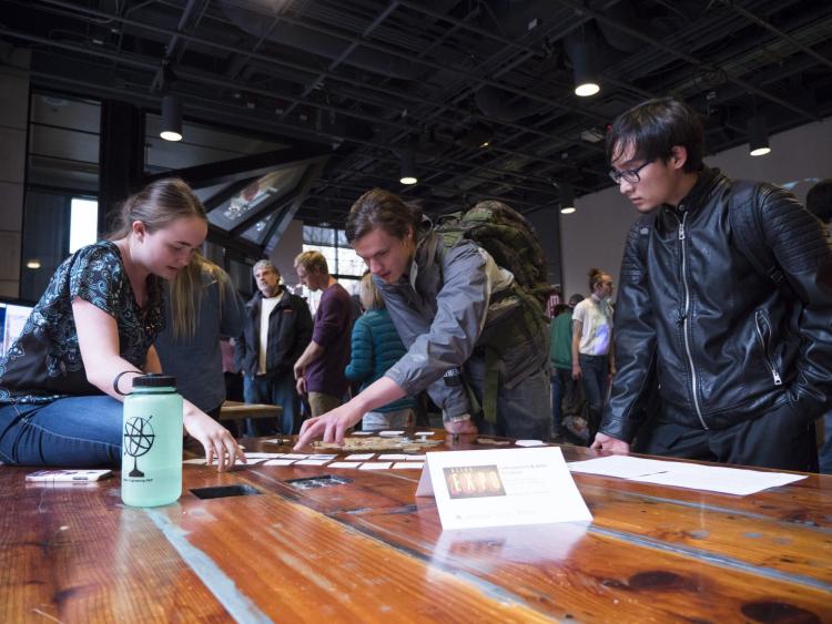 Visitors check out more than 100 student projects on display at the ATLAS expo. Photo by Patrick Campbell.