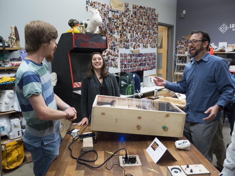 Visitors check out more than 100 student projects on display at the ATLAS expo. Photo by Patrick Campbell.