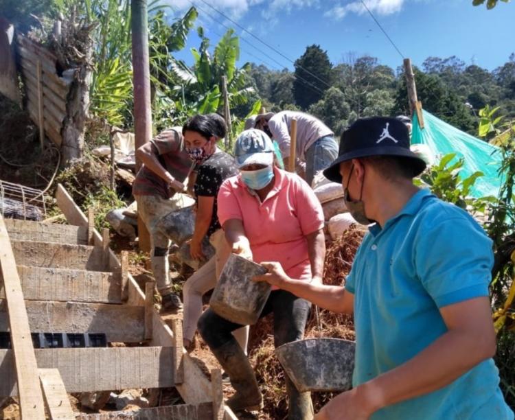 Local residents build a stairway in Medellín, Colombia