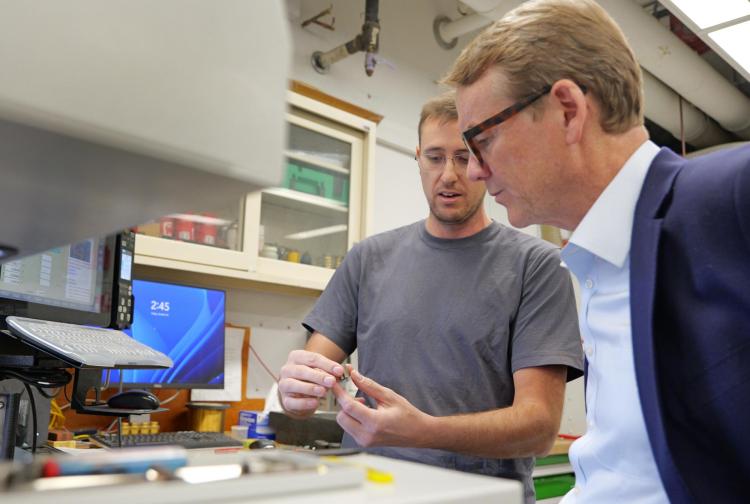 Sen. Michael Bennet visits with JILA researchers