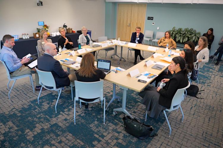 Sen. Micahel Bennet speaks with faculty and staff at the Renee Crown Wellness Institute