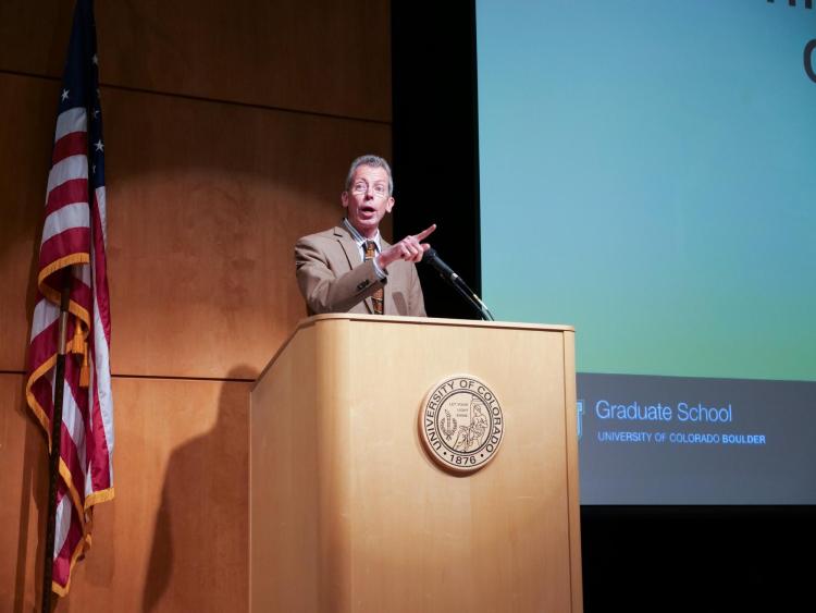 Emcee Bud Coleman at the podium