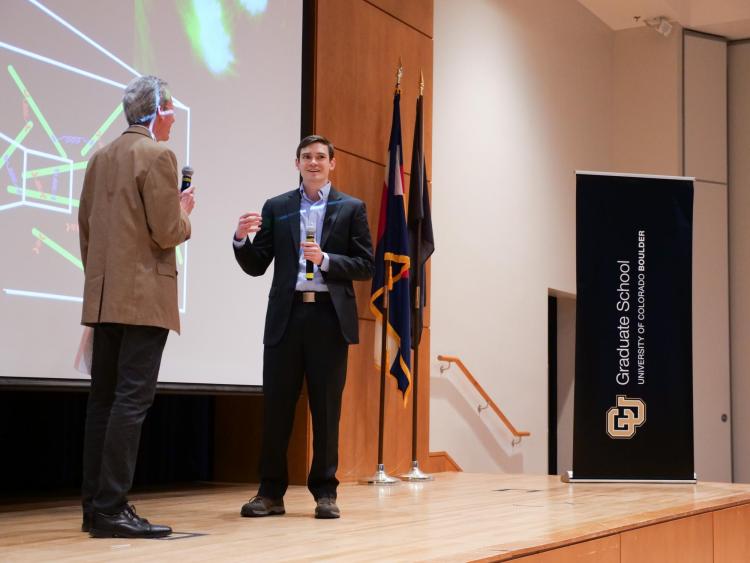 Winner Adam Lamson on stage with emcee Bud Coleman