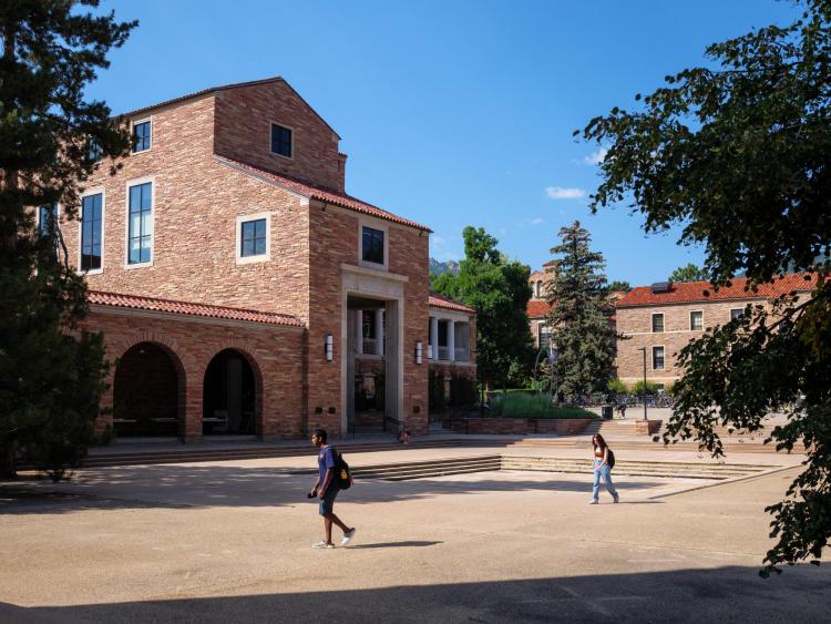 Students walk past the UMC on campus