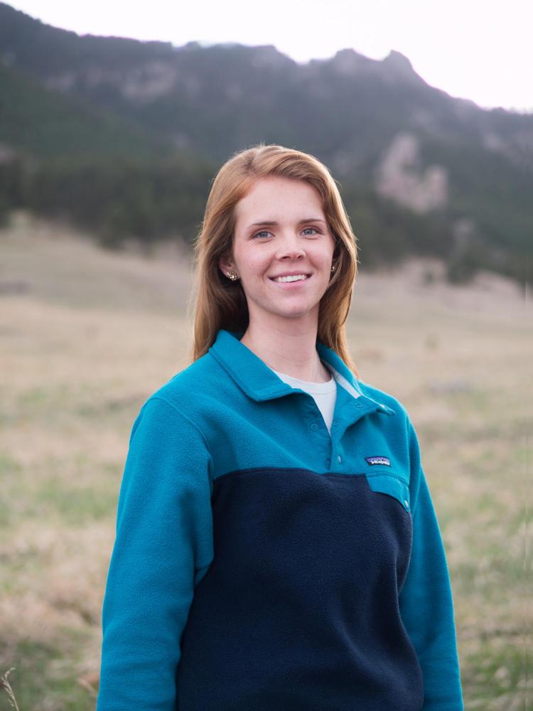 Torrey Davis at Chautauqua Park with Flatirons in background