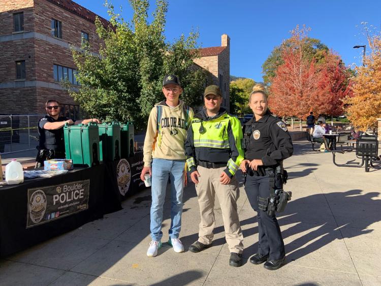 Chase Cromwell with officers Gabe Ross and Dorie Schram at a Coffee with a Cop event