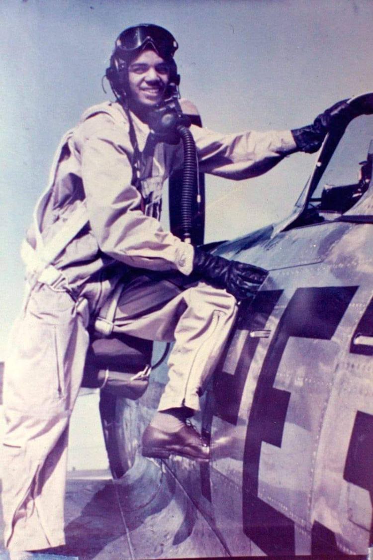 Jack Chin standing on the wing of an airplane
