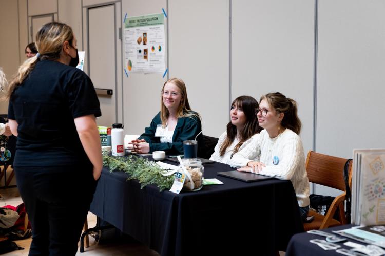 People converse at the 2023 Campus Sustainability Summit.