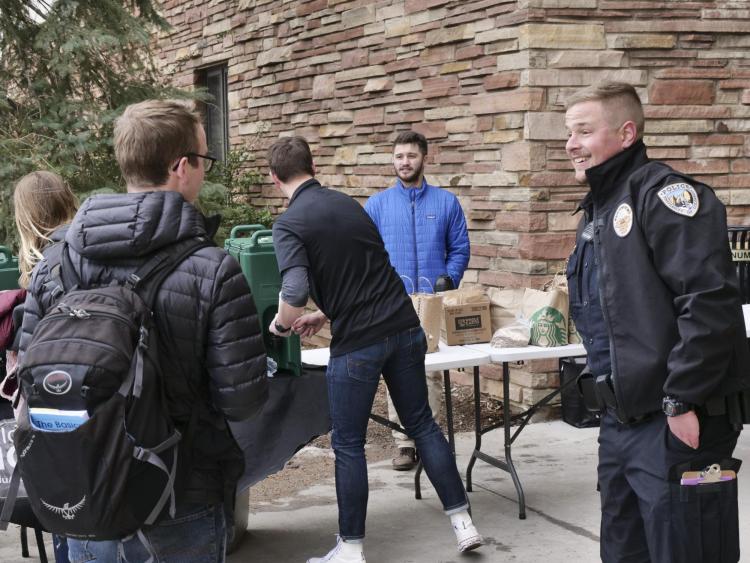 A CUPD officer engaging with students and community members