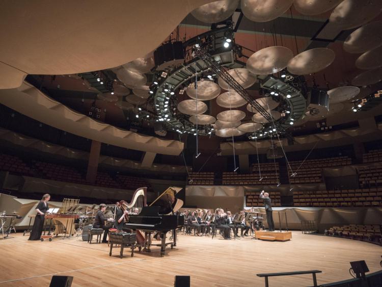 Matthew Roeder guest conducts the CU Wind Symphony in a performance of Promenade Overture during the CU at Boettcher College of Music symphony concert. Photo by Glenn Asakawa.
