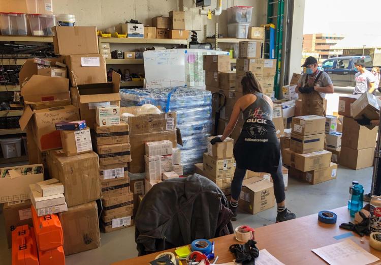 Volunteers from Team Rubicon load up CU Boulder PPE donations on Friday, April 13, 2020. (Sam Bogan/CU Boulder)