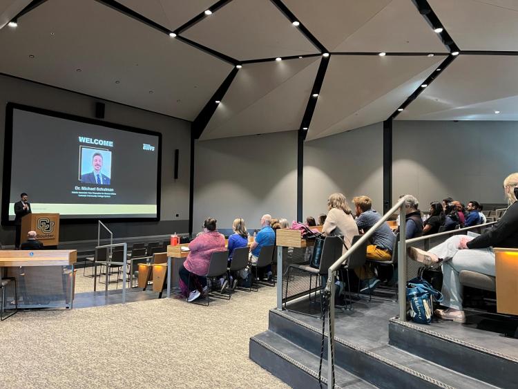Michael Schulman of the Colorado Community College System welcomes CU Boulder and community college advisors, staff and faculty