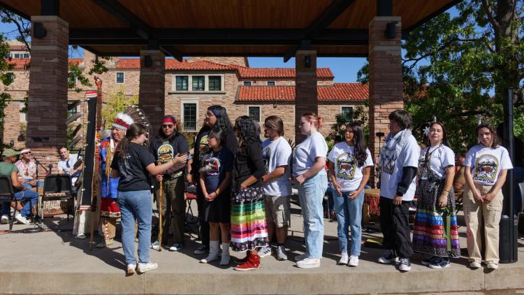 Campus community members participate in the campus powwow