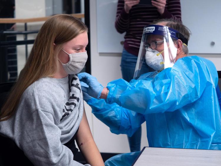 CU Boulder student Olivia Parsons getting a COVID-19 shot