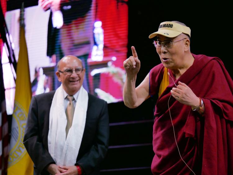 The Dalai Lama dons a CU Boulder visor