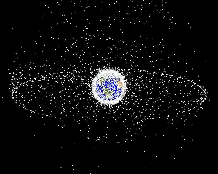 A computer-generated image representing space debris as could be seen from high Earth orbit. The two main debris fields are the ring of objects in geosynchronous Earth orbit and the cloud of objects in low Earth orbit. (Image via NASA)