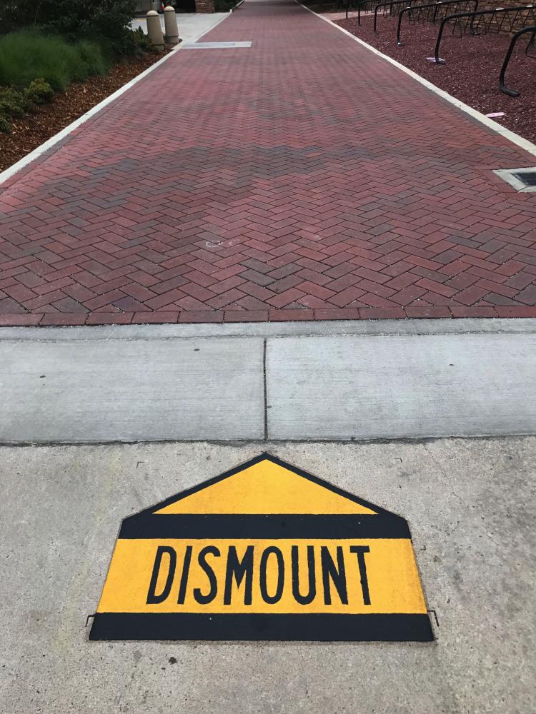 Dismount sign on campus