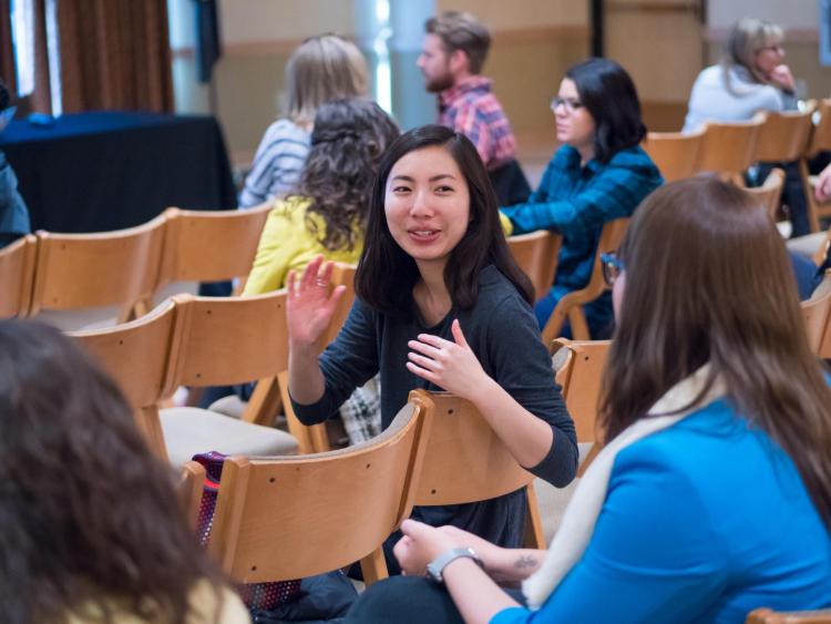 Diversity and Inclusion Summit attendees talk in small groups