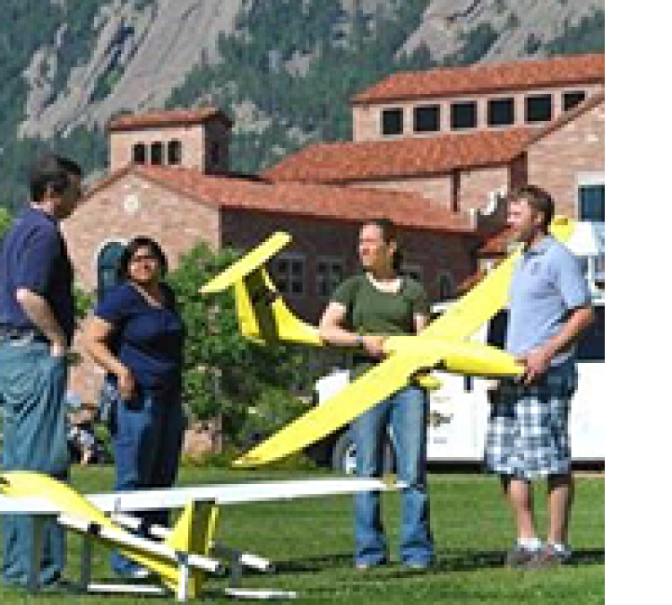 Students holding drones