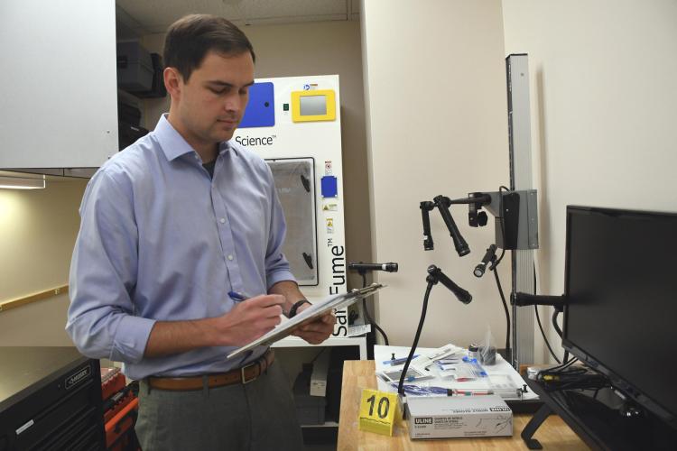 Will Heskett in the CUPD Property/Evidence and CSI lab (photo provided)