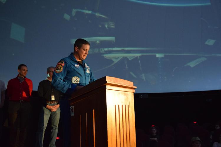 Fischer speaks at Fiske Planetarium on campus. Photo from CU Engineering.