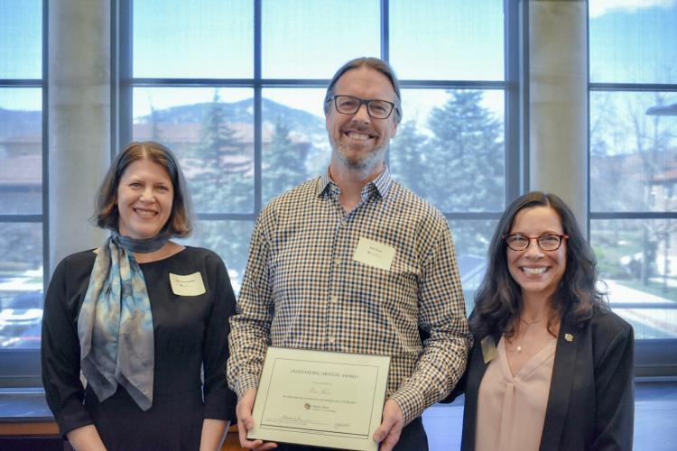 Awardee Eric Frew (center) with Vice Chancellor Michele Moses (right) and Vice Chancellor Ann Schmiesing (left)