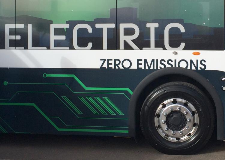 The side of an electric bus.