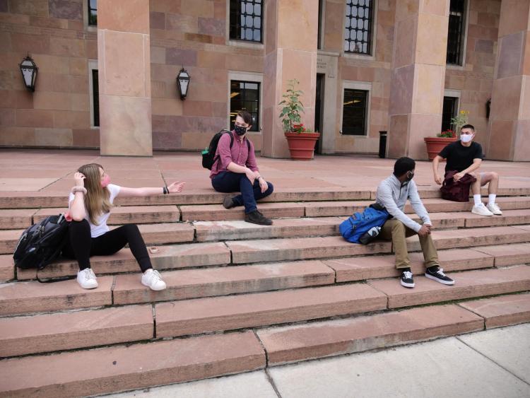 Students physically distance on campus