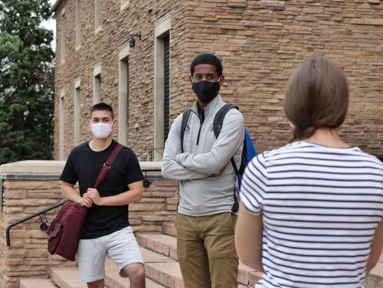 students safely socializing on campus