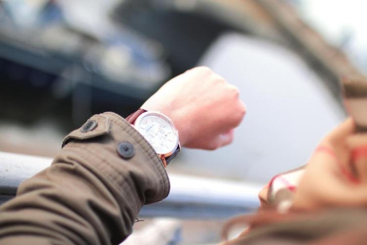 Person checks watch