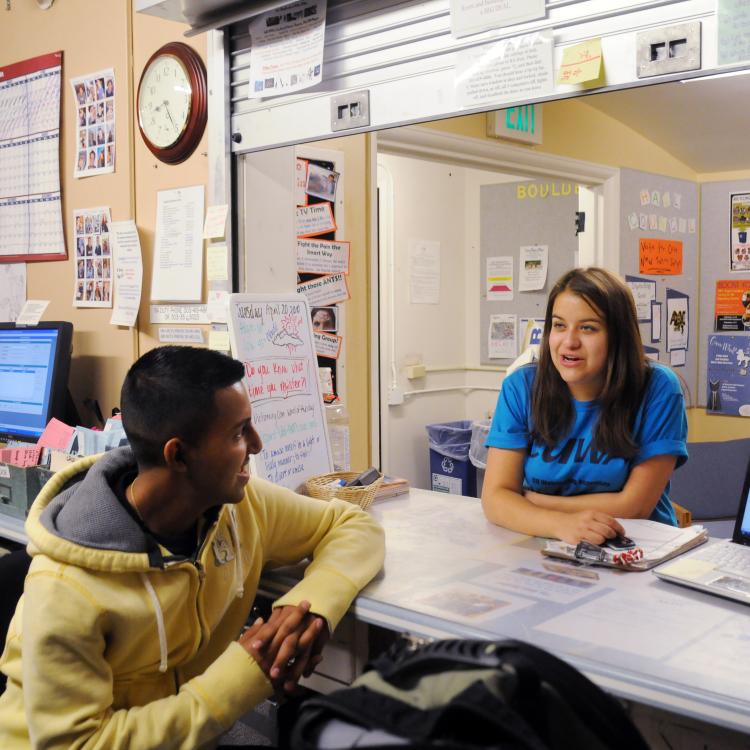 CU Boulder employee engages with student