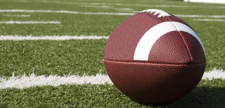 football lying on grass field