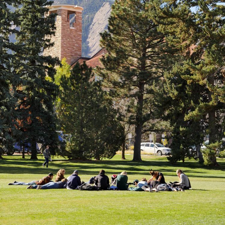 Class sits in circle outside