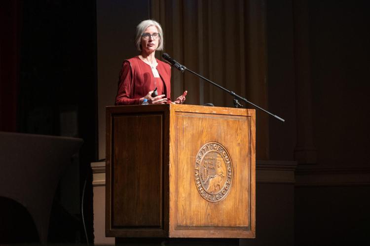 Jennifer Doudna stands on stage at a podium